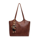 Elegant Women's Leather Tote Bag with Playful Charm