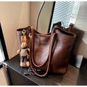Elegant Women's Leather Tote Bag with Playful Charm