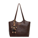 Elegant Women's Leather Tote Bag with Playful Charm