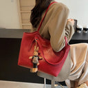 Elegant Women's Leather Tote Bag with Playful Charm